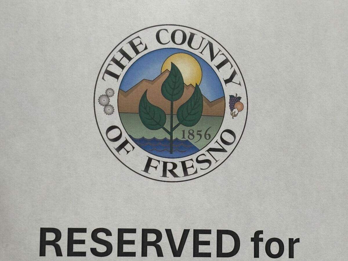 The old Fresno County logo printed on a seat saver on Tuesday, Sept. 22, 2026, at a meeting of the Board of Supervisors. They adopted a new one along with a new motto, “Farms to Forests, We Serve,” though the old logo will remain in some forms.